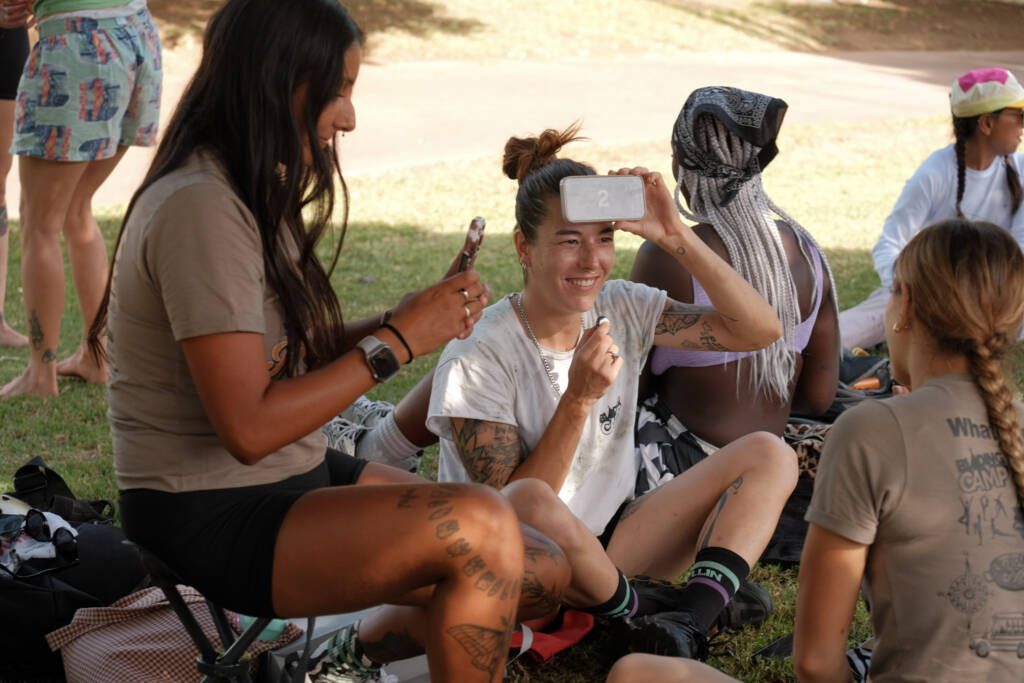 Skaters playing a game during the picnic break in the park